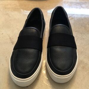 UGG black and white slip on loafers. Black pebbled leather. Exc used cond 8.5